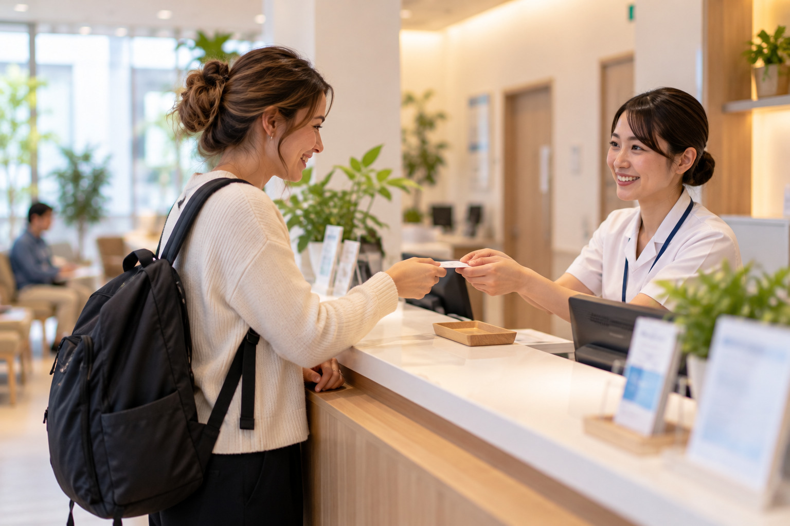 Foreign patient checking in at a clinic reception in Japan